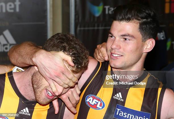 Tom Mitchell of the Hawks celebrates the win in his 100th match with Jaeger O'Meara during the round 14 AFL match between the Hawthorn Hawks and the...