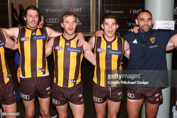 Tom Mitchell of the Hawks celebrates the win in his 100th match with Isaac Smith and Jaeger O'Meara and the injured Shaun Burgoyne of the Hawks...