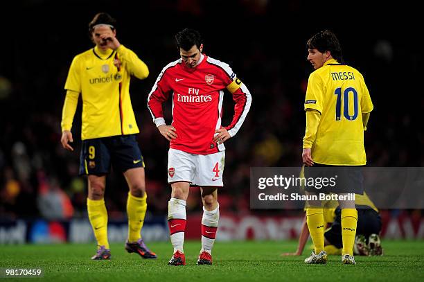 Cesc Fabregas of Arsenal reacts after being shown the yellow card by Referee Massimo Busacca of Switerland during the UEFA Champions League quarter...