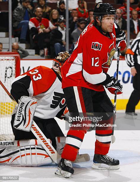 Mike Fisher of the Ottawa Senators screens goaltender Brian Boucher of the Philadelphia Flyers during their NHL game at Scotiabank Place on March 23,...