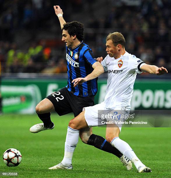 Diego Milito of FC Internazionale Milano is challenged by Vasili Berezutski of CSKA Moscow during the UEFA Champions League Quarter Finals, First Leg...