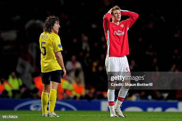 Nicklas Bendtner of Arsenal holds his head in his hands after a missed chance while defender Carles Puyol of Barcelona looks on during the UEFA...