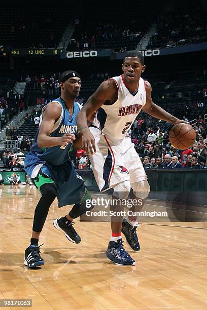 Joe Johnson of the Atlanta Hawks moves the ball against Corey Brewer of the Minnesota Timberwolves during the game on February 24, 2010 at Philips...