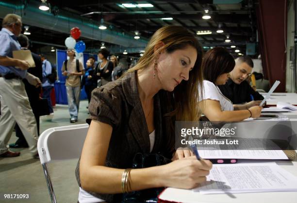 Laura Anne Fransen fills out an application during the Arizona Workforce Connection Career Expo at the Arizona State Fair Grounds on March 31, 2010...
