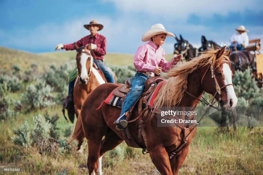 Cowboy Leader Teenager Leader With Senior And Adult Cowboys High-Res Stock Photo ...