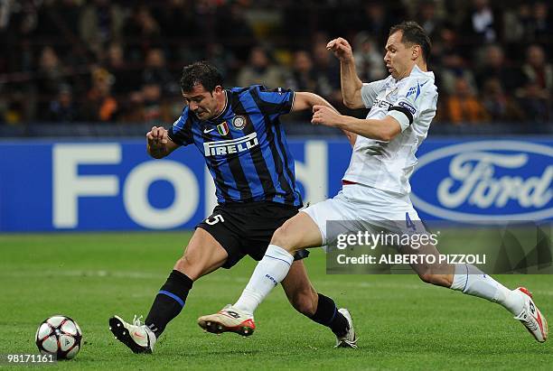 Inter Milan's Serbian midfielder Dejan Stankovic fights for the ball with Cska Moscow's defender Sergei Ignashevich during their Champions League...