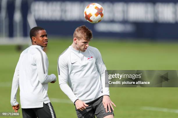 April 2018, Germany, Leipzig: RB Leipzig's Timo Werner and Ademola Lookman arrive at their last training session before RB Leipzig plays Olympique...