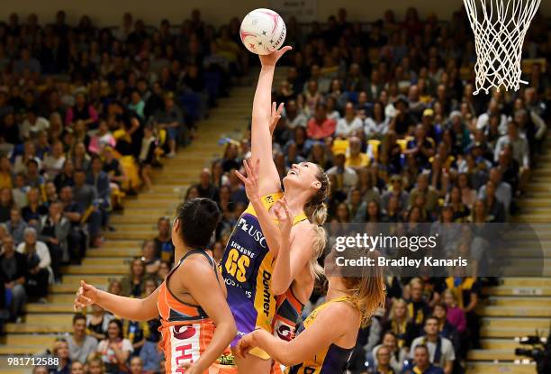 Caitlin Bassett of the Lightning competes for the ball during the round eight Super Netball match between the Lightning and the Giants at University...