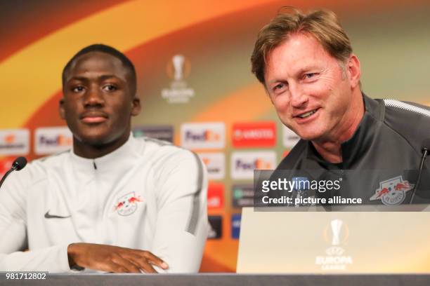 April 2018, Germany, Leipzig: Ibrahima Konate and coach Ralph Hasenhuttl take part in a press conference of their team RB Leipzig. Leipzig will face...