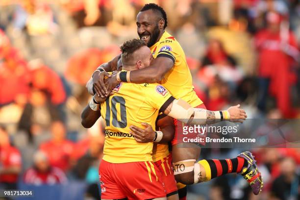 Luke Page of PNG celebrates with team mates after scoring a try during the 2018 Pacific Test Invitational match between Fiji and Papua New Guinea at...