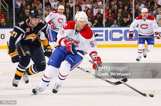 Benoit Pouliot of the Montreal Canadiens skates against Drew Stafford of the Buffalo Sabres on March 24, 2010 at HSBC Arena in Buffalo, New York.