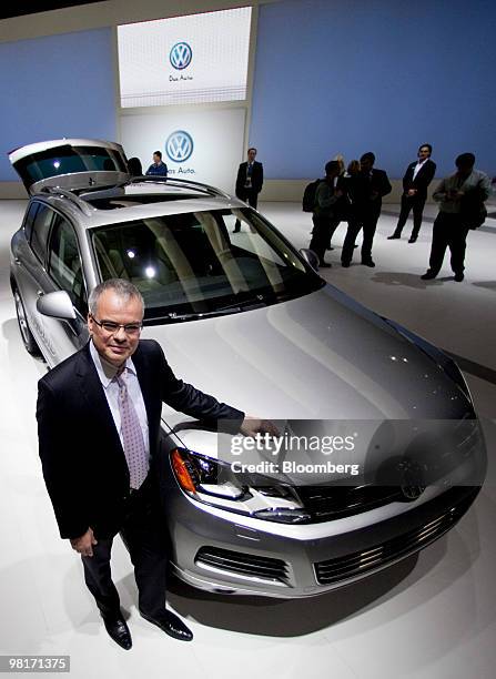 Stefan Jacoby, president and chief and chief executive officer of Volkswagen AG's North America unit, stands for a portrait with a Volkswagen Touareg...
