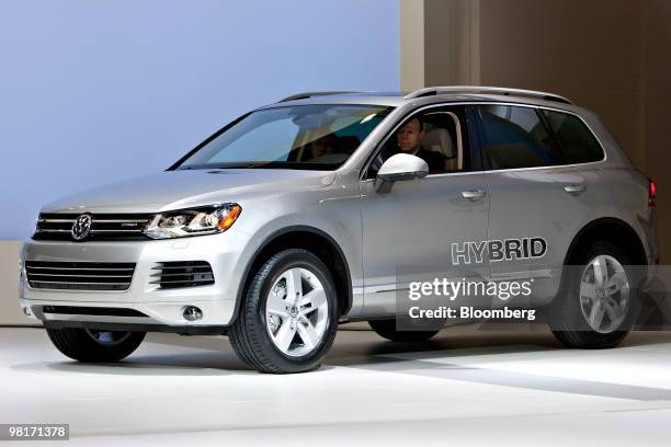 Volkswagen Touareg Hybrid is driven on stage during a media preview of the New York International Auto Show in New York, U.S., on Wednesday, March...
