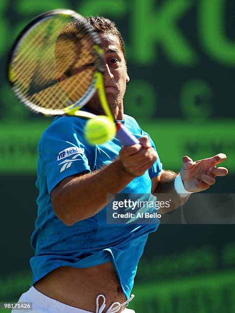 Nicolas Almagro of Spain returns a shot against Andy Roddick of the United States during day nine of the 2010 Sony Ericsson Open at Crandon Park...