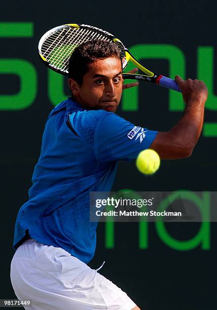 Nicolas Almagro of Spain returns a shot against Andy Roddick of the United States during day nine of the 2010 Sony Ericsson Open at Crandon Park...