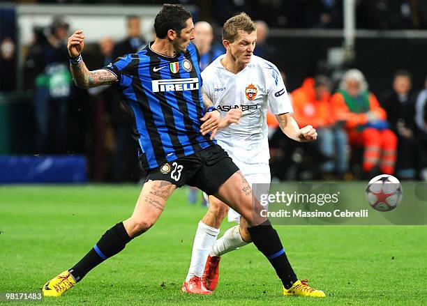 Marco Materazzi of FC Internazionale Milano battles for the ball with Tomas Nicid of CSKA Moscow during the UEFA Champions League Quarter Finals,...
