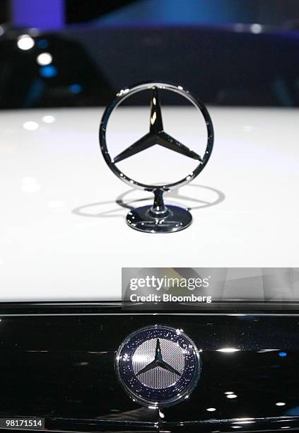 The Mercedes-Benz E-Class E350 wagon hood ornament sits on display during a media preview of the New York International Auto Show in New York, U.S.,...