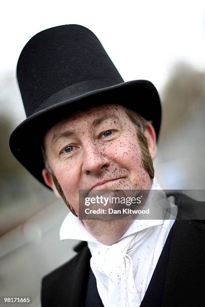 Man dressed as George Stephenson stands next to a replica of the iconic Stephenson's 'Rocket' steam locomotive in Kensington Gardens on March 31,...