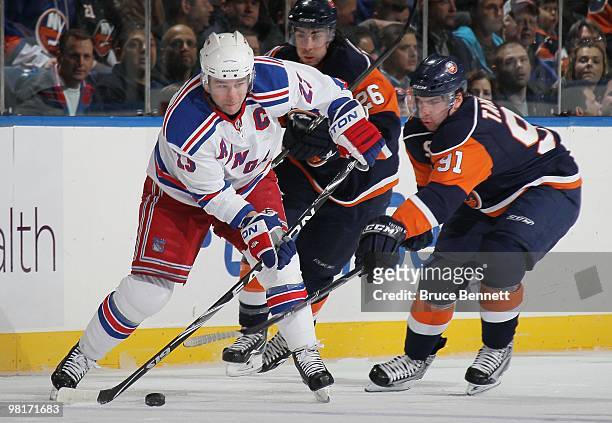 Chris Drury of the New York Rangers skates against John Tavares of the New York Islanders at the Nassau Coliseum on March 30, 2010 in Uniondale, New...