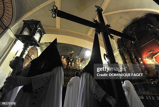 Penitents take part in the ''Nuestro Padre Jesus de la Salud" brotherhood procession during the Holy Week in Madrid on March 31, 2010. Christian...