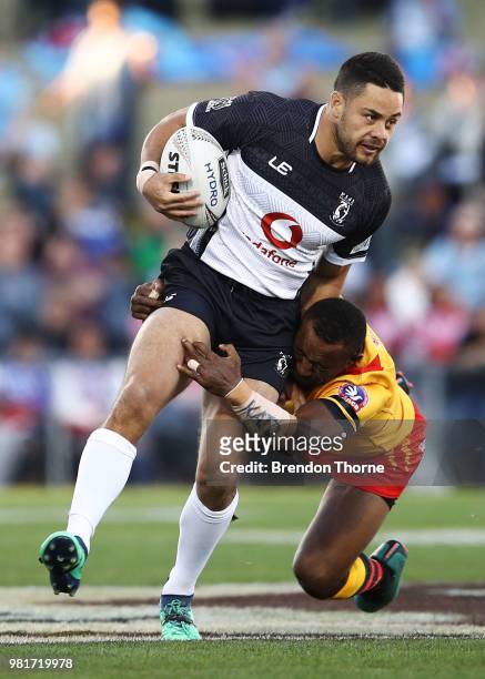 Jarryd Hayne of Fiji is tackled by the PNG defence during the 2018 Pacific Test Invitational match between Fiji and Papua New Guinea at Campbelltown...