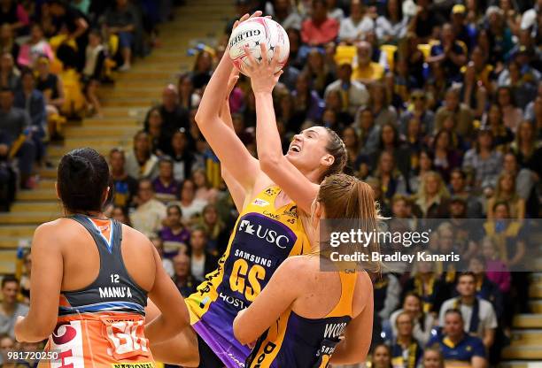 Caitlin Bassett of the Lightning challenges for the ball during the round eight Super Netball match between the Lightning and the Giants at...