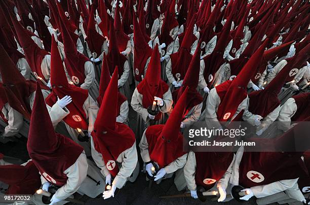 Penitents of the Cofradia del Silencio protect their candles from the wind during a Holy Week procession on March 31, 2010 in Zamora, Spain. Easter...