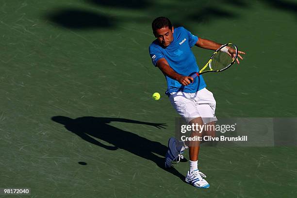 Nicolas Almagro of Spain returns a shot against Andy Roddick of the United States during day nine of the 2010 Sony Ericsson Open at Crandon Park...