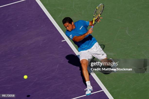 Nicolas Almagro of Spain returns a shot against Andy Roddick of the United States during day nine of the 2010 Sony Ericsson Open at Crandon Park...