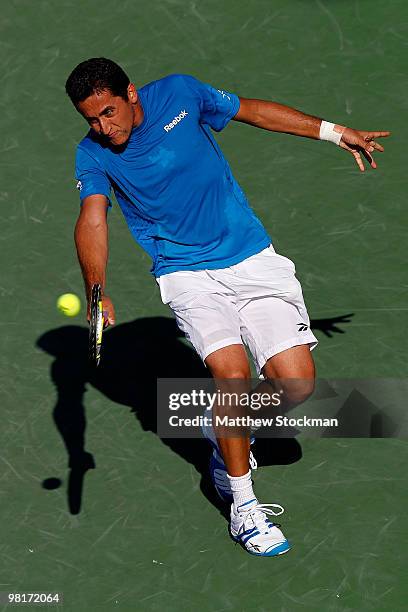 Nicolas Almagro of Spain returns a shot against Andy Roddick of the United States during day nine of the 2010 Sony Ericsson Open at Crandon Park...