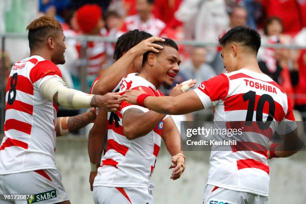 Lomano Lava Lemeki of Japan celebrates scoring his side's second try with his team mates during the rugby international match between Japan and...