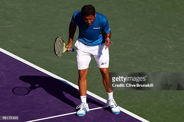 Nicolas Almagro of Spain reacts after a point against Andy Roddick of the United States during day nine of the 2010 Sony Ericsson Open at Crandon...