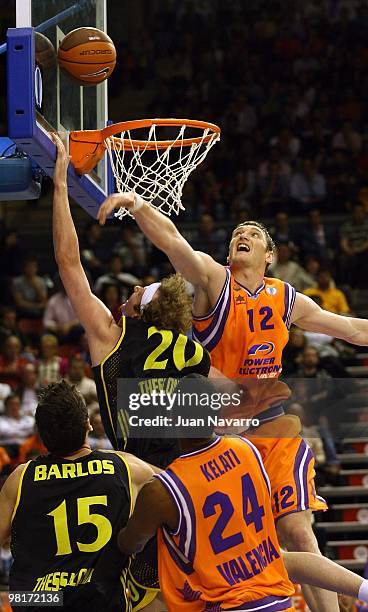 Serhiy Lishchuk, #12 of Power Electronics Valencia competes with Matt Walsh, #20 of Aris BSA 2003 during the Eurocup Quarterfinals Game 2 between...