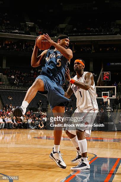 Dominic McGuire of the Washington Wizards rebounds against Stephen Jackson of the Charlotte Bobcats during the game on February 9, 2010 at the Time...