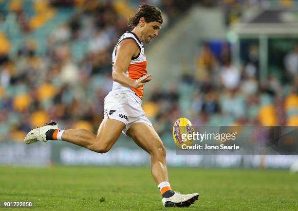 Ryan Griffen of the Giants kicks a goal during the round 14 AFL match between the Brisbane Lions and the Greater Western Sydney Giants at The Gabba...
