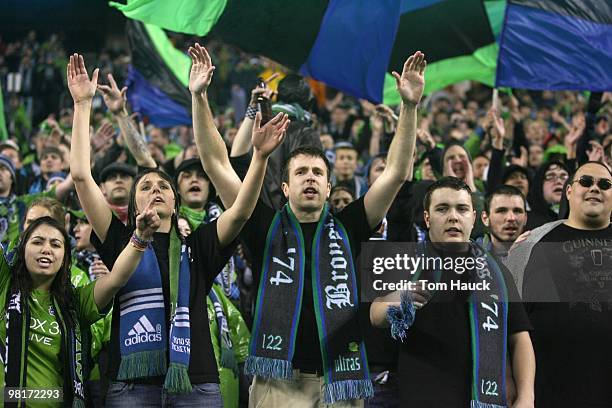 Fans of the Seattle Sounders FC cheer during the game against the Philadelphia Union at Qwest Field on March 25, 2010 in Seattle, Washington. The...
