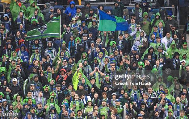 Fans of the Seattle Sounders FC cheer during the game against the Philadelphia Union at Qwest Field on March 25, 2010 in Seattle, Washington. The...