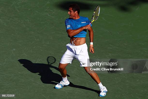 Nicolas Almagro of Spain returns a shot against Andy Roddick of the United States during day nine of the 2010 Sony Ericsson Open at Crandon Park...