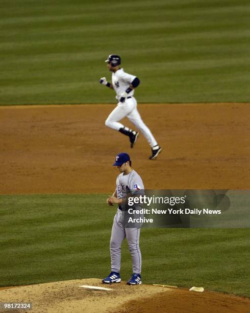 Derek Jeter of the New York Yankees rounds the bases after he hit a home run in the 4th inning off of pitcher C.J. Wilson of the Texas Rangers on...