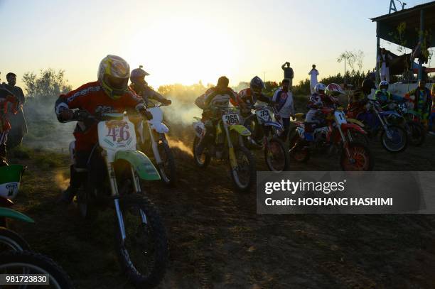 In this photograph taken on June 22, 2018 Afghan riders take part in a freestyle motocross event in the western city of Herat.
