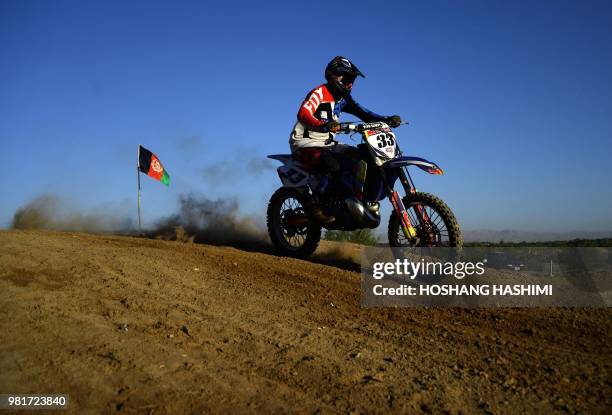 In this photograph taken on June 22, 2018 an Afghan rider takes part in a freestyle motocross event in the western city of Herat.