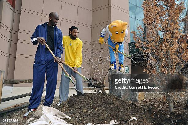 Johan Petro and Renaldo Balkman of the Denver Nuggets along with SuperMascot Rocky kick-off NBA Green Week by planting two fir trees at Pepsi Center...