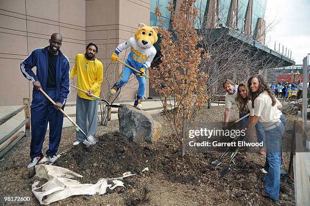 Johan Petro and Renaldo Balkman of the Denver Nuggets along with SuperMascot Rocky, Tom Tolkacz of Swingle Tree and Lawn Care and members of the...