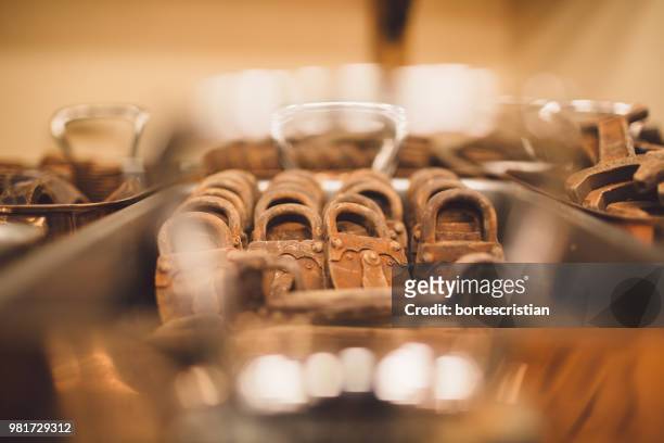 close-up of rusty metallic padlocks in tray - bortes stock-fotos und bilder