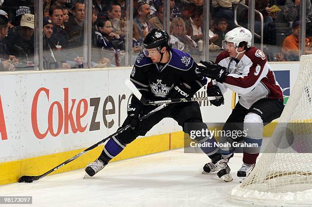 Drew Doughty of the Los Angeles Kings skates with the puck against Matt Duchene of the Colorado Avalanche on March 22, 2010 at Staples Center in Los...