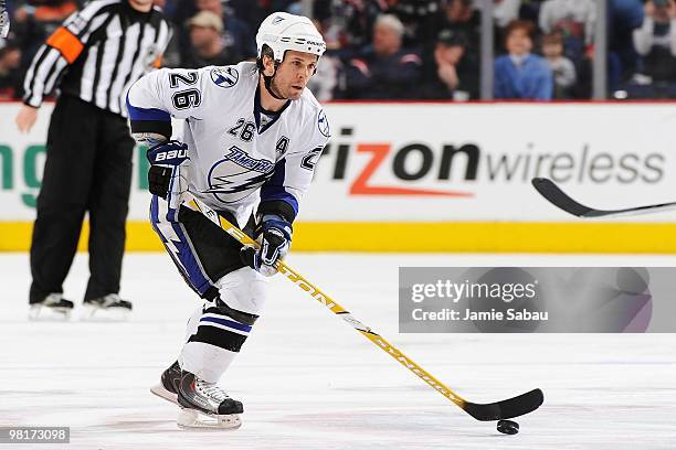 Forward Martin St. Louis of the Tampa Bay Lightening skates with the puck against the Columbus Blue Jackets on March 30, 2010 at Nationwide Arena in...