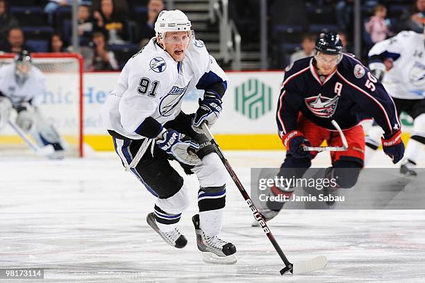 Forward Steven Stamkos of the Tampa Bay Lightening skates with the puck against the Columbus Blue Jackets on March 30, 2010 at Nationwide Arena in...