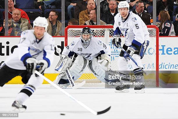 Goaltender Antero Niittymaki of the Tampa Bay Lightening gets help defending the net against the Columbus Blue Jackets from teammates Todd Fedoruk...
