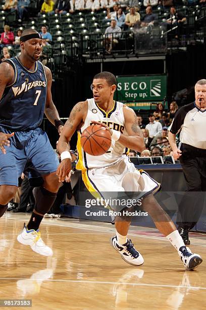 Earl Watson of the Indiana Pacers handles the ball against Andray Blatche of the Washington Wizards during the game on March 24, 2010 at Conseco...