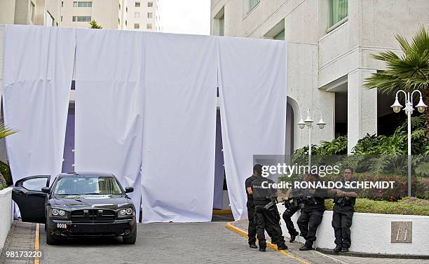 Members of the Mexican police stand guard in front of the building where the corpse of four-year-old Paulette Gebara was found, in Interlomas...